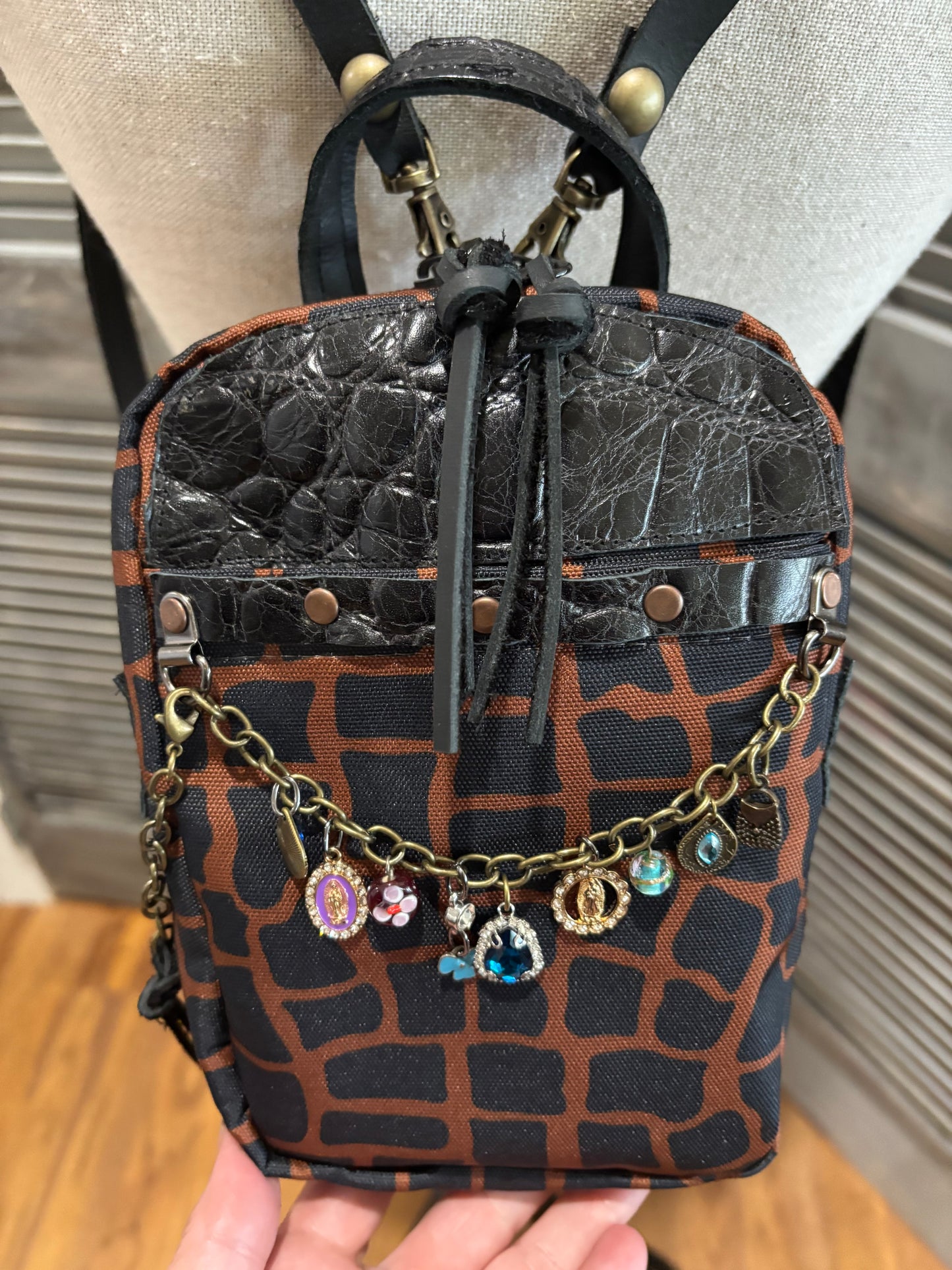Mini X Back Pack Alligator Canvas with leather trim and chain with charms accent