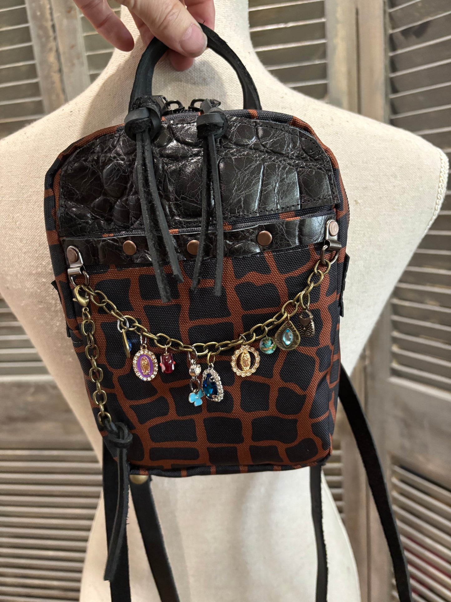 Mini X Back Pack Alligator Canvas with leather trim and chain with charms accent