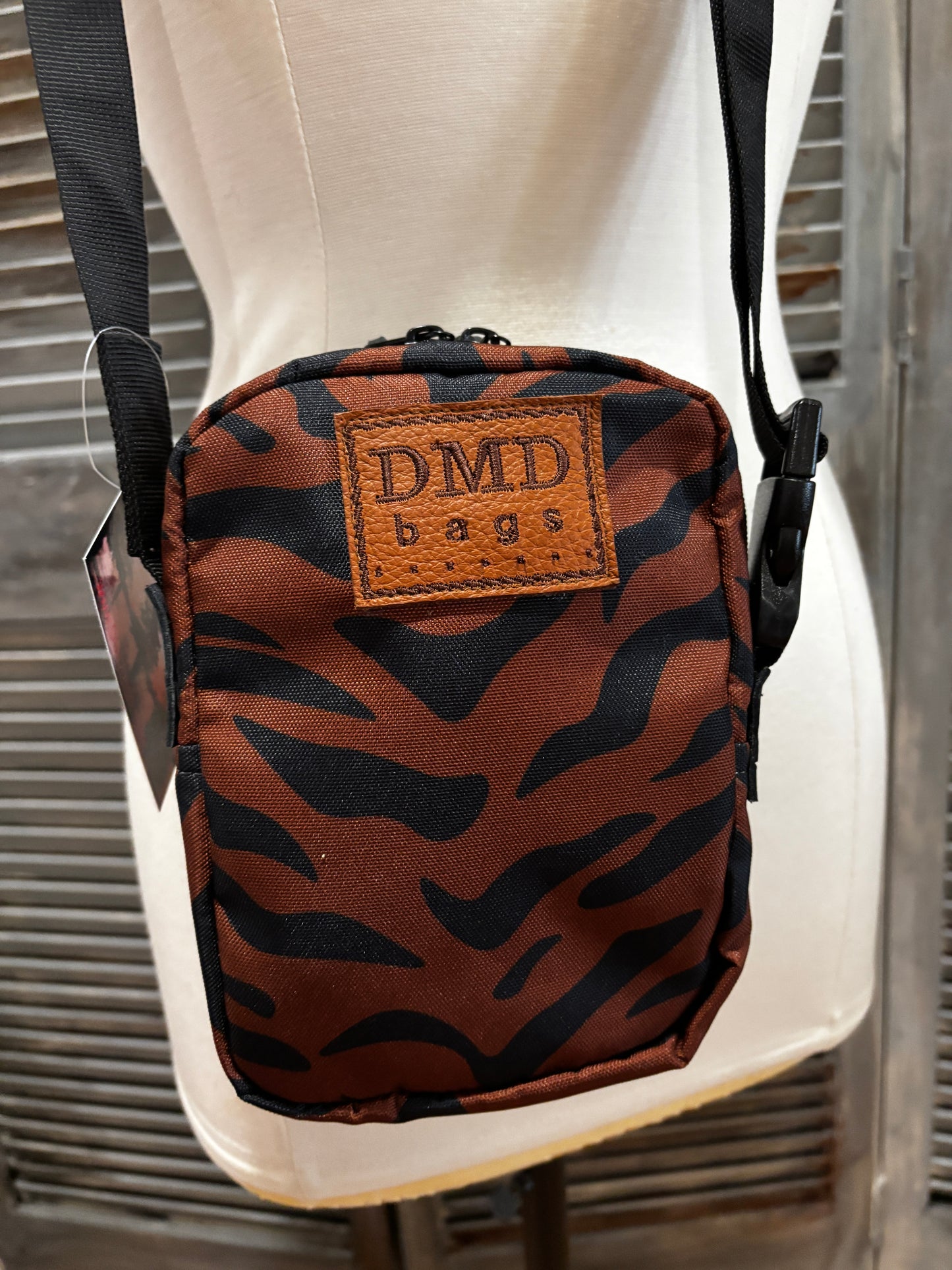 The X Bag in Brown Tiger stripe with genuine alligator