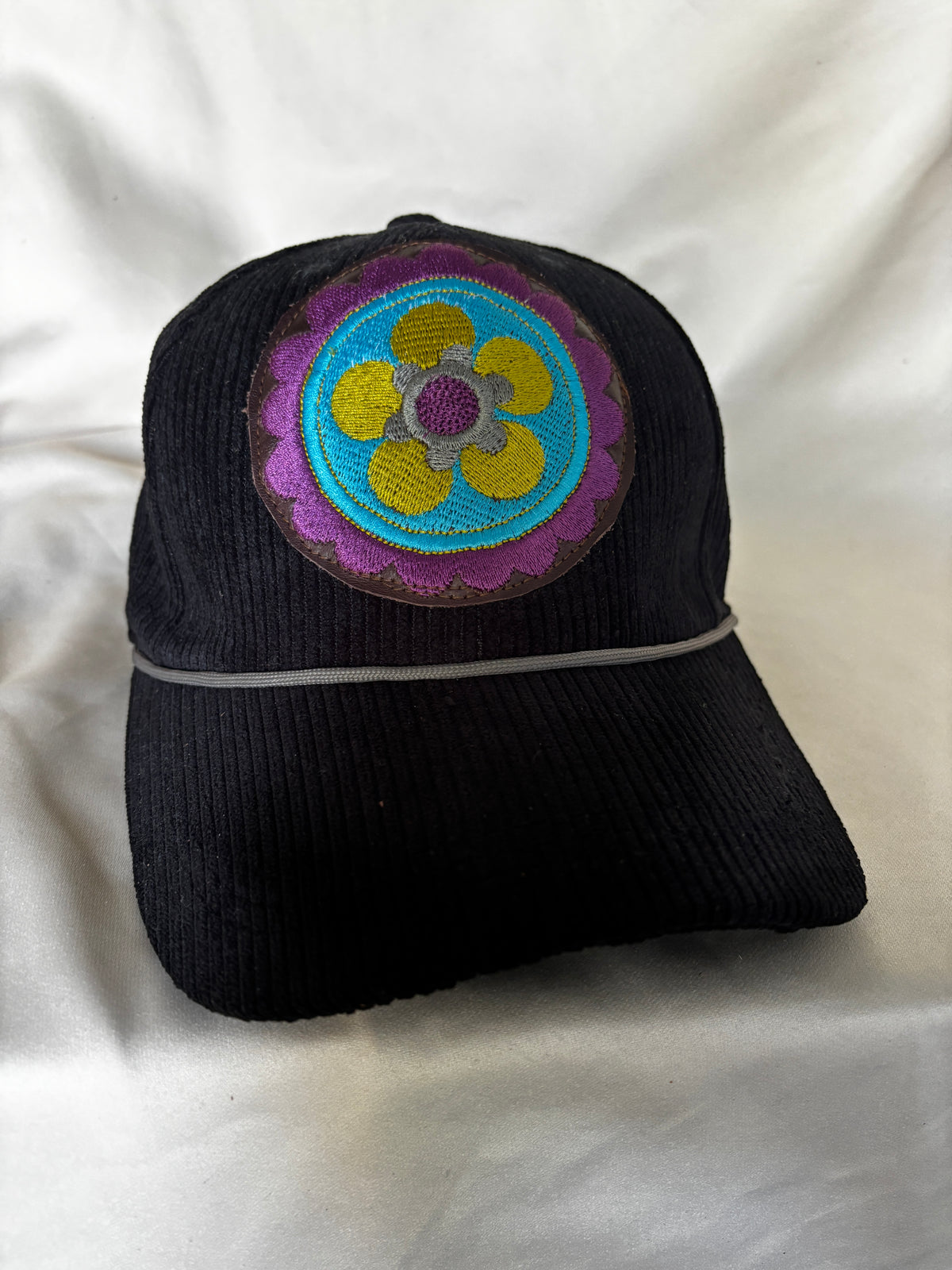 Corduroy Ball Cap in Black with Embroidered Medallion with Rope detail