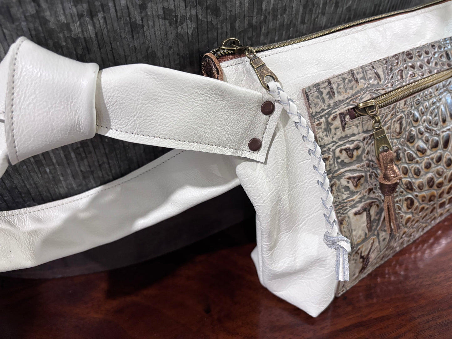 “Tie the Knot” wristlet in a cream leather with emboss croc leather pocket