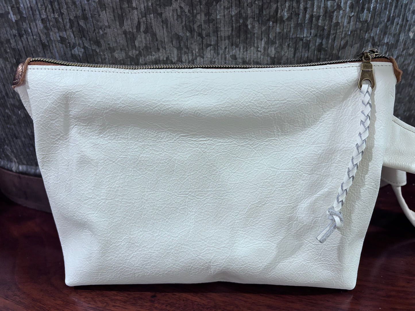 “Tie the Knot” wristlet in a cream leather with emboss croc leather pocket