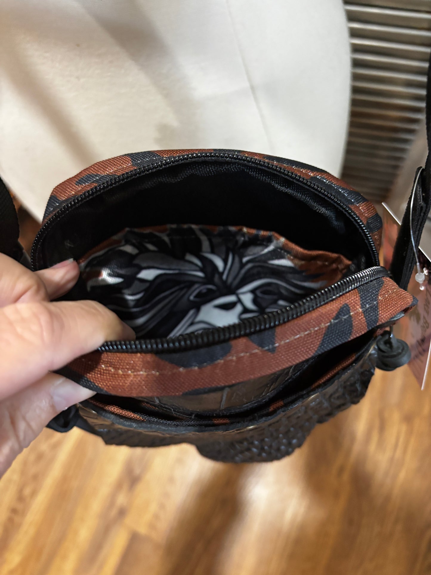 The X Bag in Brown Tiger stripe with genuine alligator