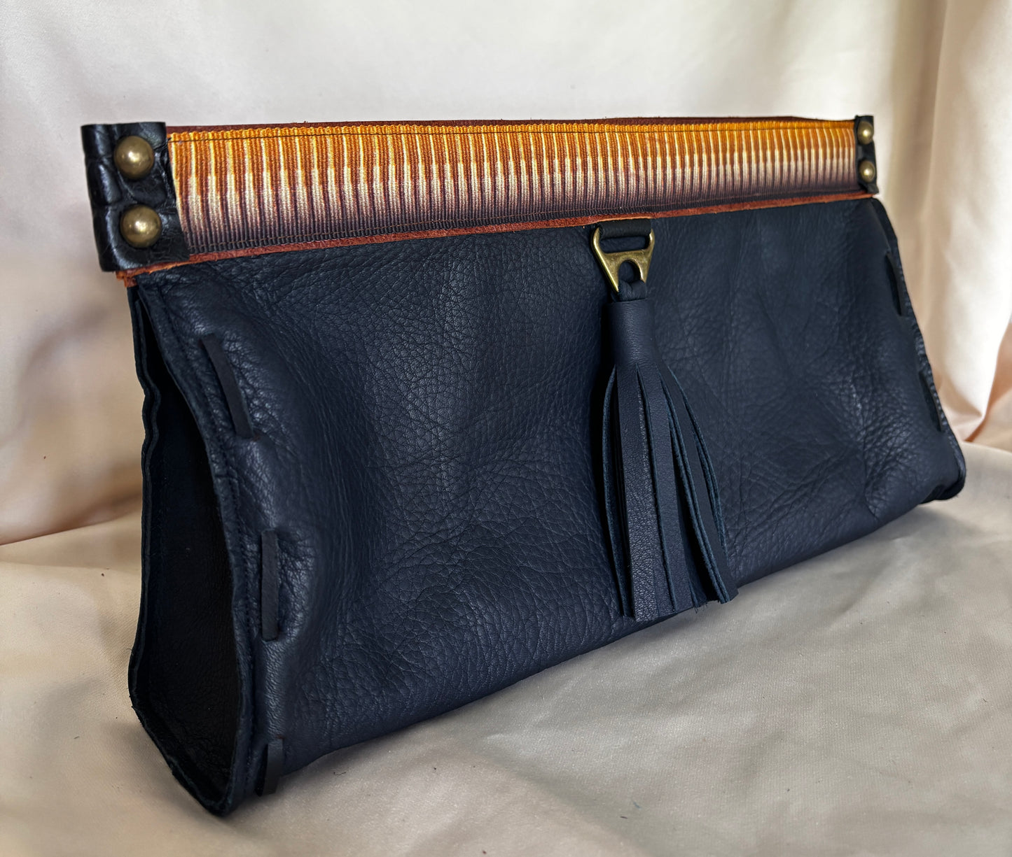 Leather Clutch in Navy & Caramel Abstract Trim & Tassel