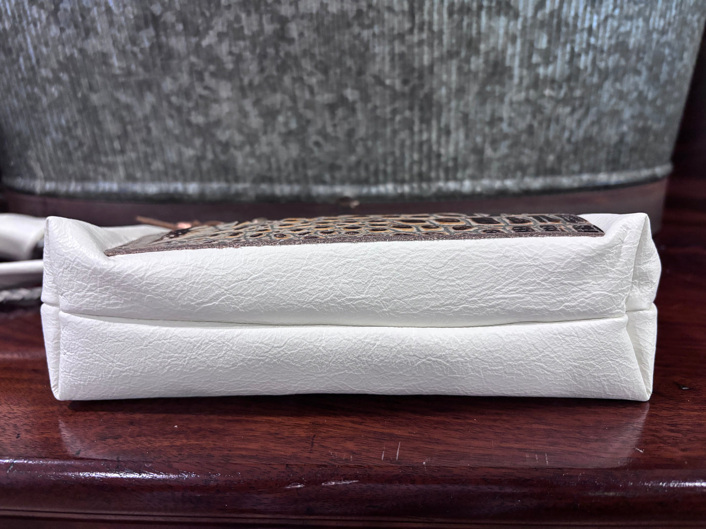 “Tie the Knot” wristlet in a cream leather with emboss croc leather pocket