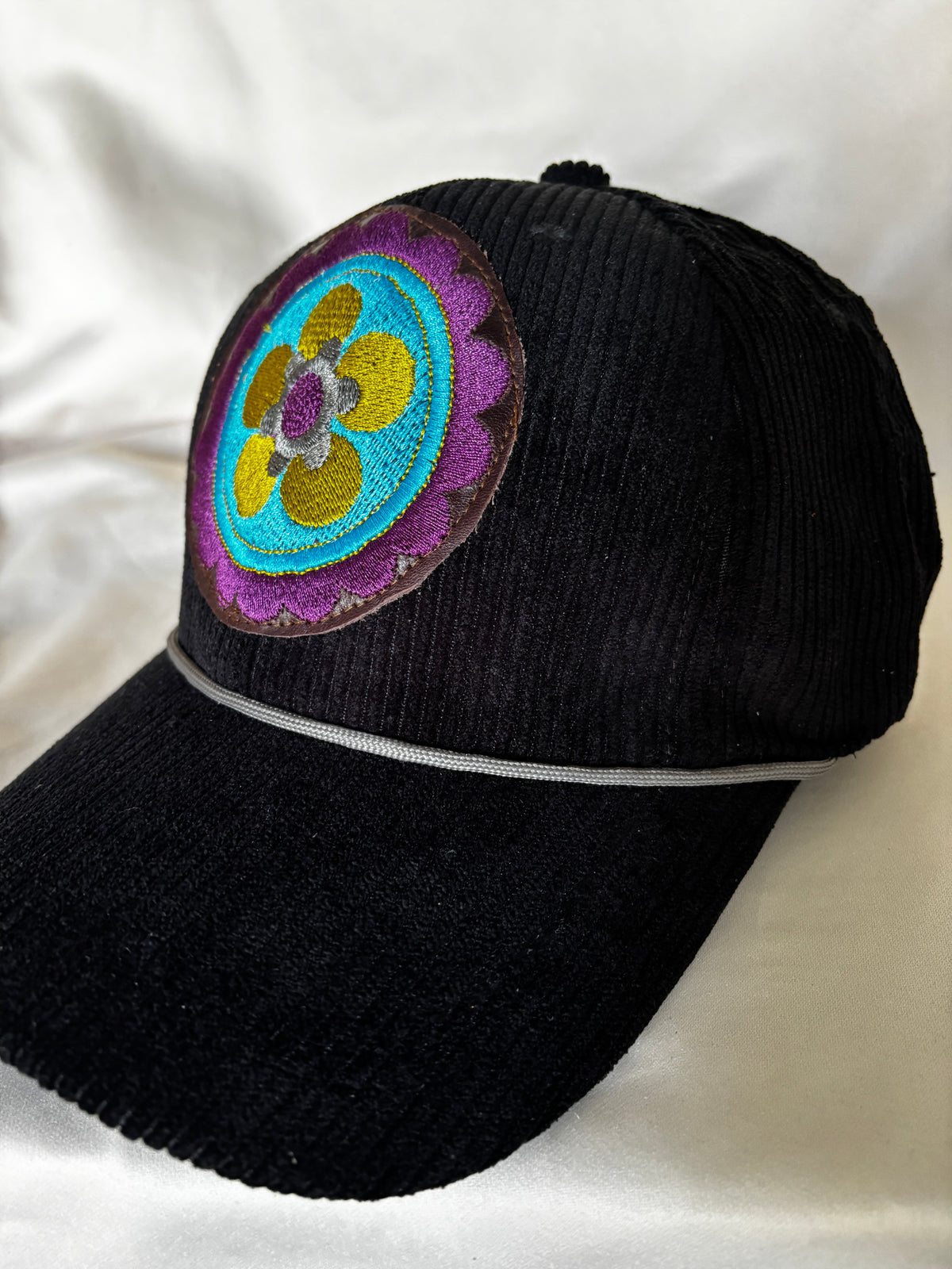Corduroy Ball Cap in Black with Embroidered Medallion with Rope detail